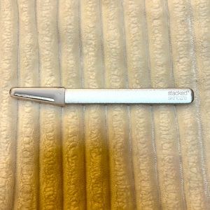 Stacked Skincare dermaplaning facial tool.
